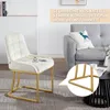 A beige upholstered chair with gold metal legs is shown in a living room setting, next to a gray sofa. A close-up of the chair's legs is also visible. Produktbild-Vorschau