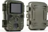 A camouflage-patterned trail camera and its open casing are displayed against a white background. Produktbild-Vorschau