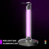 A gaming headset stand with RGB lighting and a USB hub, presented against a dark, gradient background. Produktbild-Vorschau