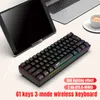 A compact keyboard is placed on a desk next to a tablet and a laptop, with a cup of coffee in the background. Produktbild-Vorschau
