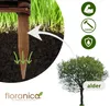 A close-up of a wooden stake in the ground with grass and soil, with an arrow pointing to an alder tree, and icons representing strength, durability, and protection. Produktbild-Vorschau