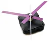 A close-up shot of a clock mechanism with purple hands against a white background. Produktbild-Vorschau