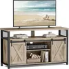 A TV stand with a television on top, displaying a beach scene. Voir les images du produit
