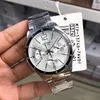 A person's hand is holding a silver Casio watch with a white face and black accents. A product tag is attached to the watch. Produktbild-Vorschau