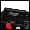 A close-up view of the top of a black air compressor, showing the handle, a red knob, a switch, and a pressure gauge. Anteprima dell’immagine prodotto