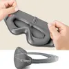 Hands adjusting a grey sleep mask, with a second view of the mask. Náhled obrázku produktu