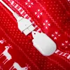 A close-up view of a white electrical connector and its cap on a red blanket with a snowflake and reindeer pattern. Podgląd zdjęcia produktu