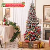 A decorated Christmas tree and table setting in a room. Náhľad obrázku produktu