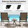 Two chairs and a table set up on a deck next to a pool. Anteprima dell’immagine prodotto