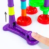 A close-up shot of a colorful toy marble run with a finger pressing down on a purple lever. Produktbild-Vorschau