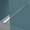 A close-up view of a shower enclosure support bar attached to a glass panel and a blue wall. Produktbild-Vorschau