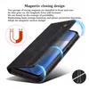 A black leather flip case for a smartphone, shown partially open with blue light effects indicating magnetic closure. Produktbild-Vorschau