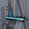 A close-up view of a modern shower system with a digital display and waterfall spout. Podgląd zdjęcia produktu