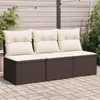 An outdoor sofa with beige cushions sits on a paved patio, with a wooden fence and plants in the background. Náhľad obrázku produktu