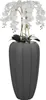 A tall artificial orchid plant with white flowers in a dark gray ribbed pot. Voir les images du produit