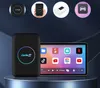 A Carlinkit TBOX LITE S device and its screen interface are displayed on a pedestal against a dark blue background. Small circular icons illustrating the product's features are shown at the top. Produktbild-Vorschau