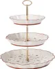 A three-tiered cake stand with decorative patterns on the plates and rims. Anteprima dell’immagine prodotto
