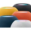 A collection of Apple HomePod mini smart speakers in various colors. Voir les images du produit