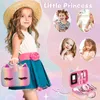 A young girl in a straw hat and blue dress holding a unicorn makeup case, with smaller inset images of other girls playing with makeup. Voir les images du produit