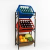 A three-tiered metal shelving unit filled with bottles and produce. Produktbild-Vorschau