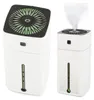 A collage of two white humidifiers, one showing the top with a fan and mist outlet, the other showing mist coming out. Náhled obrázku produktu