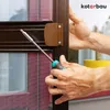 A person is using a screwdriver to install a brown door handle on a screen door. Anteprima dell’immagine prodotto