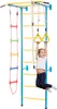 A young girl is hanging from yellow gymnastic rings attached to a blue and yellow indoor climbing frame. Náhled obrázku produktu