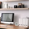 A desk with a computer, shelves, and office supplies. Náhled obrázku produktu
