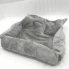 A plush, gray pet bed is shown on a white surface. Náhľad obrázku produktu
