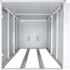 Interior view of an empty, light gray metal storage unit with double doors at the back and tracks on the floor. Náhled obrázku produktu