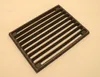 A cast iron grate for a stove or fireplace. Anteprima dell’immagine prodotto