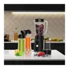 A black VERTENZ Titan 30 stand mixer is displayed on a white countertop with various accessories and ingredients for making smoothies. Podgląd zdjęcia produktu