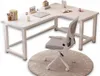 A white L-shaped desk with a white office chair on a round rug. Produktbild-Vorschau
