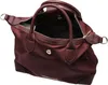 A burgundy handbag is shown from a slightly elevated side angle with the top open. Produktbild-Vorschau