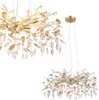 Two views of a decorative chandelier with crystal-like elements and a gold-colored frame. Anteprima dell’immagine prodotto