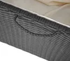 Close-up of a woven gray handle on a beige cushion. Náhled obrázku produktu