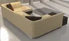 A sectional sofa in a modern living room setting with a rug and large windows. Náhled obrázku produktu