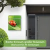 A mailbox with a ladybug design is mounted on a white wall next to a modern gray door. Produktbild-Vorschau
