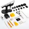 A collection of watch repair tools laid out on a white background. Náhled obrázku produktu