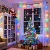 A decorated room for Christmas with a Christmas tree, lights, and gifts. Produktbild-Vorschau