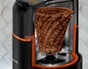 A cutaway view of a coffee grinder showing the internal grinding mechanism. Náhled obrázku produktu