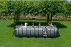 A family is enjoying a swim in an above-ground pool in a backyard setting. Náhled obrázku produktu