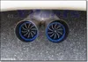 Close-up of a car's dual exhaust pipes with decorative turbine inserts. Anteprima dell’immagine prodotto