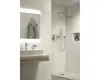 A modern bathroom with a sink and a shower. Produktbild-Vorschau