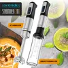 A marketing image showcasing a 2-in-1 hand blender and smoothie maker, with accompanying food items. Produktbild-Vorschau