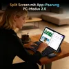 A woman is using a tablet with a keyboard and mouse in a living room setting. Produktbild-Vorschau