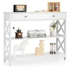 A white console table with three shelves and a drawer, decorated with various items. Náhľad obrázku produktu