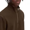 Close-up of a person wearing a brown half-zip pullover. Produktbild-Vorschau