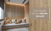 A cozy reading nook with wooden slat wall panels, a built-in bench with cushions and stuffed animals, and a window with a roller blind. Anteprima dell’immagine prodotto