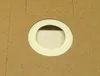 A close-up view of a vacuum cleaner bag opening with a white ring and filter material visible. Anteprima dell’immagine prodotto